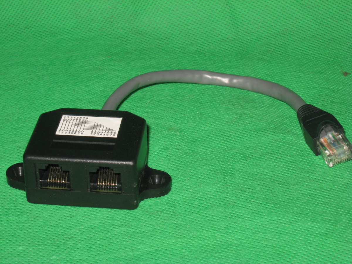 NNISDN-Verteiler RJ45 Stecker auf 2xRJ45 Kupplungen mit ca. 15cm Kabel schwarzArtikel-Nr: ISDN-0016L